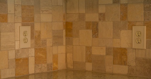 Travertine tile backsplash installation